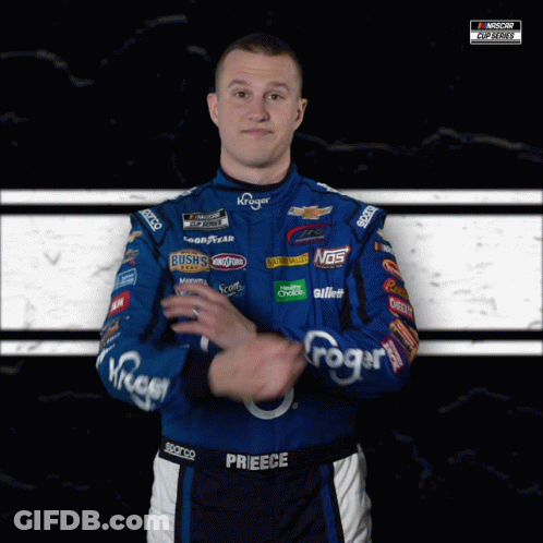 A Man Wearing A Blue And Black Racing Suit With The Name Prieece On It GIF
