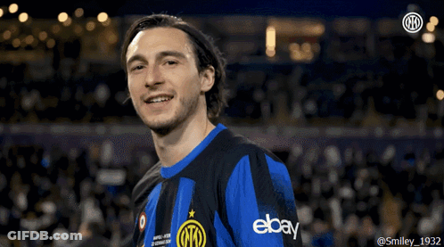 A Man Wearing A Blue And Black Shirt With Ebay On It GIF