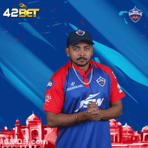 A Man Wearing A Blue And Red Jersey With The Word Delhi Carnival On It GIF