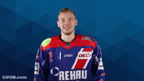 A Man Wearing A Blue And Red Rehau Jersey Poses For A Picture GIF