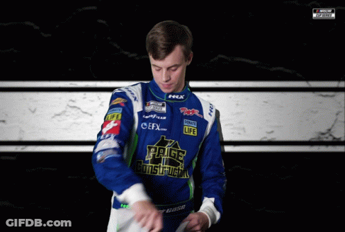A Man Wearing A Blue And White Jacket With The Word Construction On The Front GIF