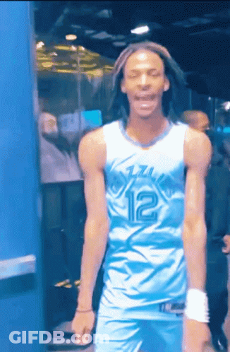 A Man Wearing A Blue And White Jersey With The Number 12 On It GIF