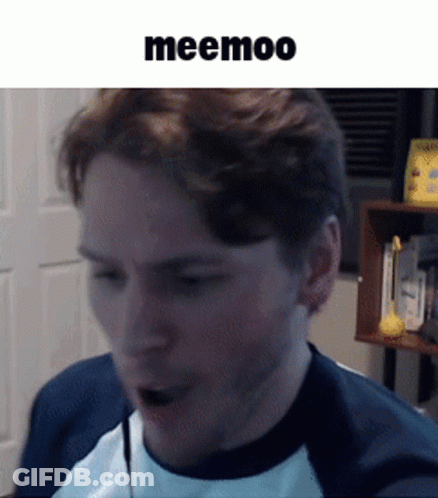 A Man Wearing A Blue And White Shirt Is Talking Into A Microphone With The Word Meemoo Above Him GIF