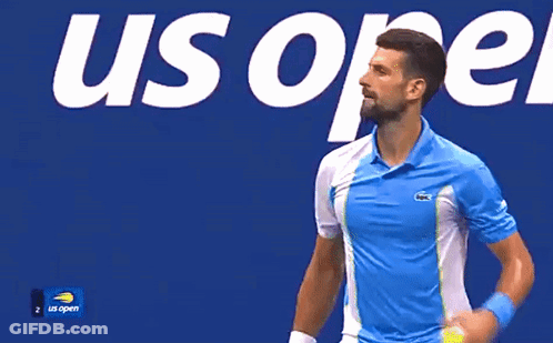 A Man Wearing A Blue And White Shirt With A Lacoste Logo GIF