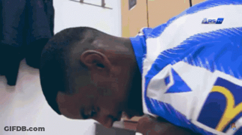 A Man Wearing A Blue And White Shirt With The Letter D On The Sleeve GIF