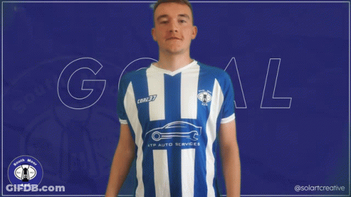 A Man Wearing A Blue And White Striped Shirt With The Word Goal In White Letters GIF