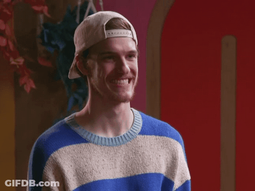 A Man Wearing A Blue And White Striped Sweater And A White Hat GIF