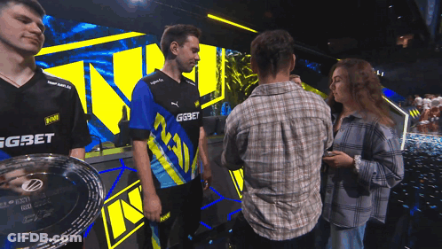 A Man Wearing A Blue And Yellow Shirt With Gg On It GIF