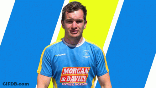 A Man Wearing A Blue And Yellow Shirt With Morgan & Davies On It GIF