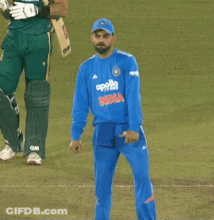 A Man Wearing A Blue Apollo India Jersey Stands On A Field GIF