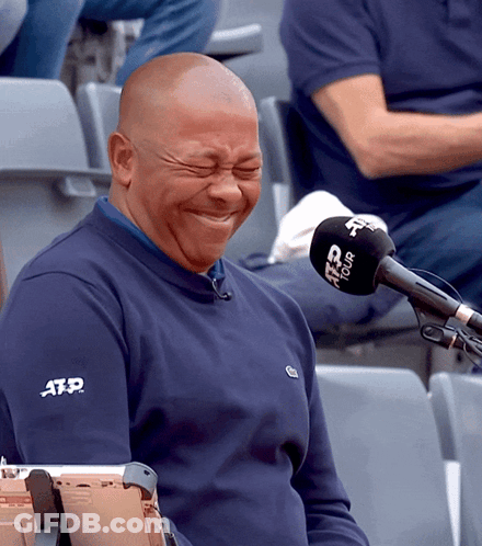 A Man Wearing A Blue Atp Shirt Is Laughing GIF
