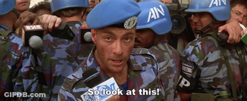 A Man Wearing A Blue Beret With An On It Says So Look At This GIF