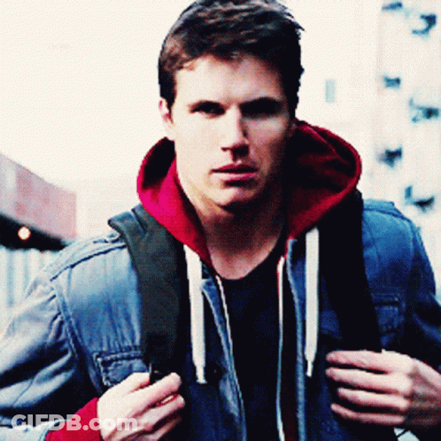 A Man Wearing A Blue Denim Jacket And A Red Hoodie GIF