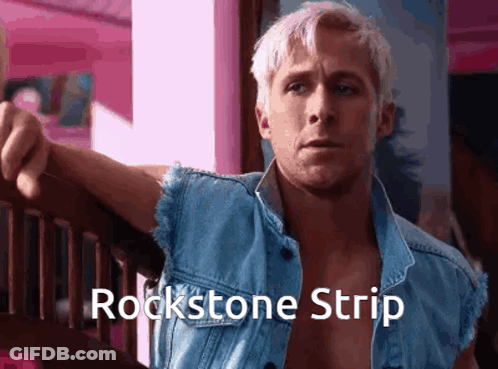 A Man Wearing A Blue Denim Vest With The Words Rockstone Strip On It GIF