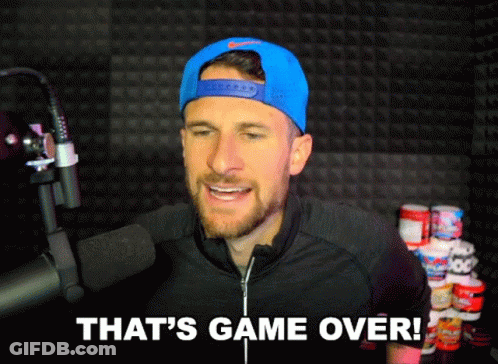A Man Wearing A Blue Hat And A Black Jacket Says That 'S Game Over GIF