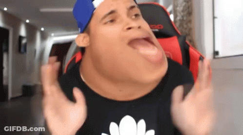 A Man Wearing A Blue Hat And A Black Shirt Is Making A Funny Face With His Mouth Open . GIF
