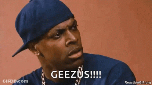 A Man Wearing A Blue Hat And A Necklace Is Saying Geezus . GIF