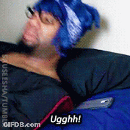 A Man Wearing A Blue Hat And Glasses Is Laying In A Sleeping Bag And Says Ugghh GIF