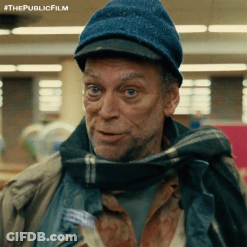 A Man Wearing A Blue Hat And Scarf Has The Publicfilm Written On The Bottom GIF