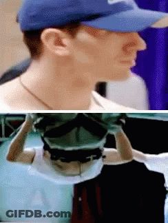 A Man Wearing A Blue Hat Has The Letter A On The Front Of His Shirt GIF