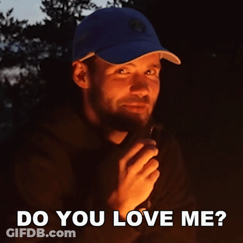 Man In Blue Hat Holding Lighter Do You Love Me GIF