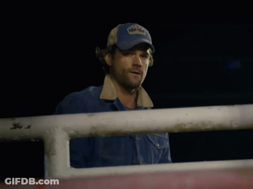 A Man Wearing A Blue Hat That Says Texas On It GIF