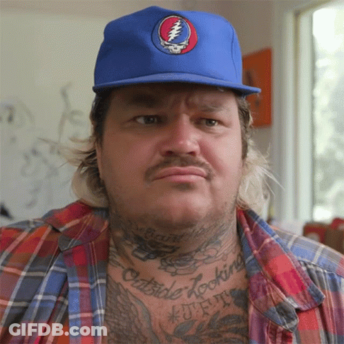 A Man Wearing A Blue Hat With A Grateful Dead Logo GIF