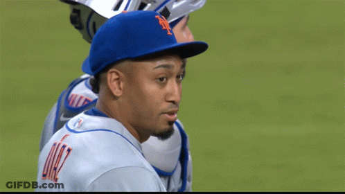 A Man Wearing A Blue Hat With The Letter N On It GIF