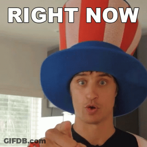 A Man Wearing A Blue Hat With The Words Right Now Written On It GIF