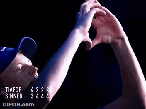 A Man Wearing A Blue Hat With The Words Tiafoe Sinner Written On It GIF