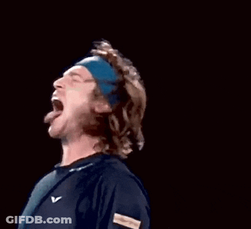 A Man Wearing A Blue Headband With The Letter V On It Is Screaming GIF