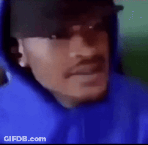 A Man Wearing A Blue Hoodie And A Hat . GIF