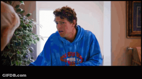 A Man Wearing A Blue Hoodie With Rolling Stones On The Front GIF