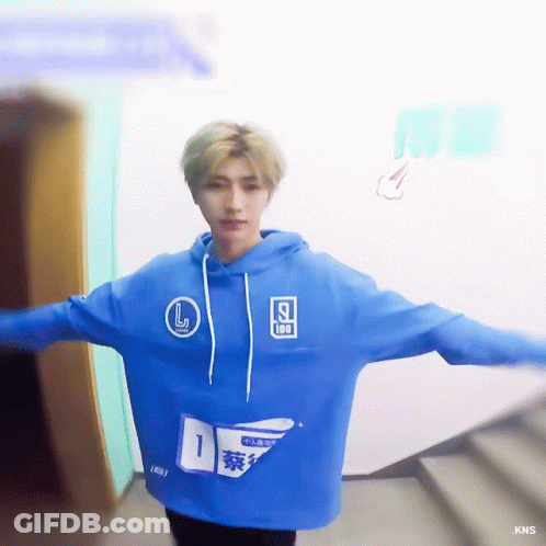 A Man Wearing A Blue Hoodie With The Number 1 On The Front GIF