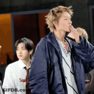 A Man Wearing A Blue Jacket And A White Shirt With The Word Supreme On It GIF