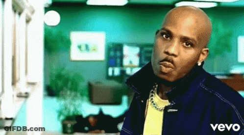 A Man Wearing A Blue Jacket And A Yellow Shirt With The Word Vevo On The Bottom GIF