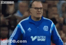 A Man Wearing A Blue Jacket That Says ' Intersport ' On It GIF