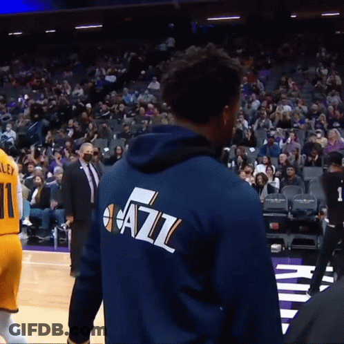 A Man Wearing A Blue Jacket That Says Jazz GIF