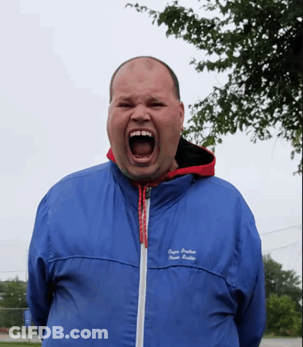 A Man Wearing A Blue Jacket That Says " Super Premium " On The Front GIF