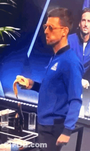 A Man Wearing A Blue Jacket With The Letter A On The Front GIF