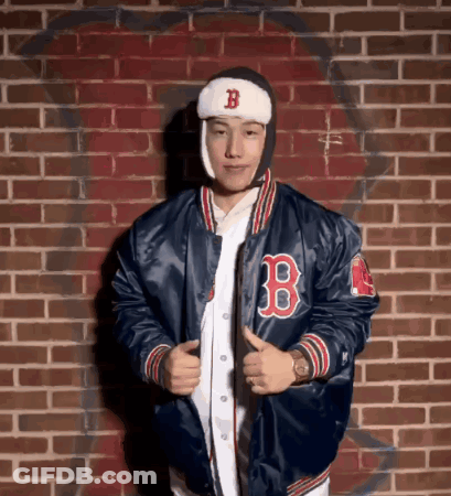 A Man Wearing A Blue Jacket With The Letter B On The Front GIF