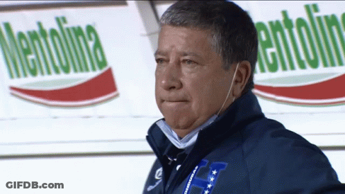 A Man Wearing A Blue Jacket With The Letter H On The Front GIF