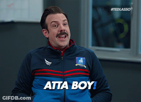 A Man Wearing A Blue Jacket With The Word Atta Boy On It GIF