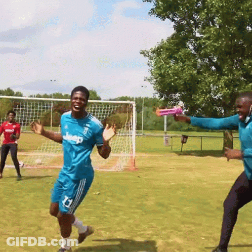 A Man Wearing A Blue Jeep Jersey Is Holding A Frisbee GIF