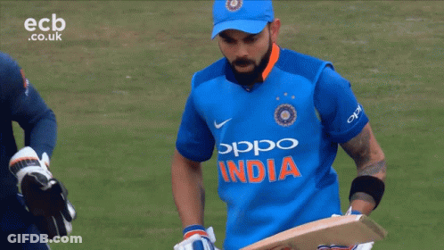 A Man Wearing A Blue Jersey That Says India GIF