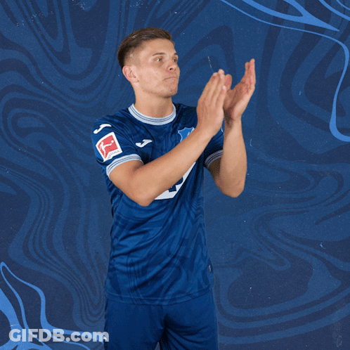 A Man Wearing A Blue Jersey With The Number 5 On It Applauds GIF