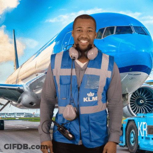 A Man Wearing A Blue Klm Vest Stands In Front Of A Blue Airplane GIF