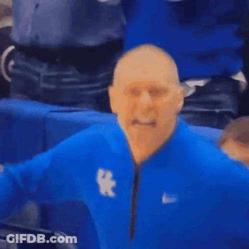 A Man Wearing A Blue Nike Jacket With The Letter X On The Front GIF