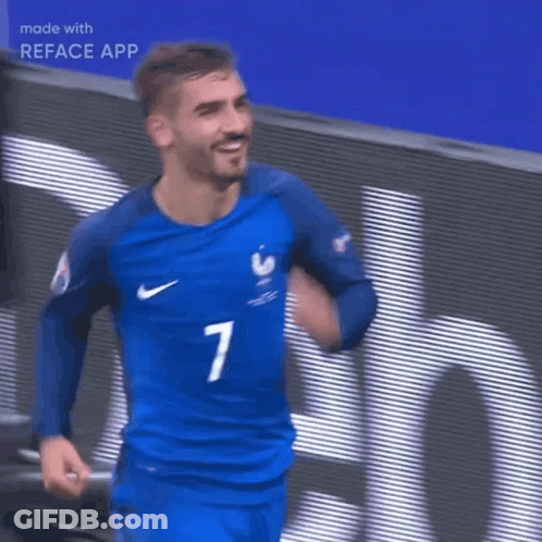 A Man Wearing A Blue Nike Jersey Is Holding A Soccer Ball In His Hands GIF