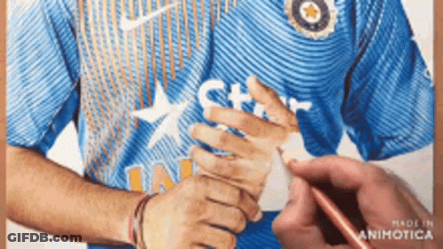 A Man Wearing A Blue Nike Shirt With A Star On The Front GIF